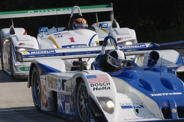 Dyson Racing Lola EX257-AER leading an ADT/Champion Audi R8 (American LeMans LMP1)